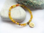Bransoletka z agatu żółtego  z przywieszką w odcieniu miedzi z rysunkiem Beaty Pawlikowskiej Orzeł - obrazek 4